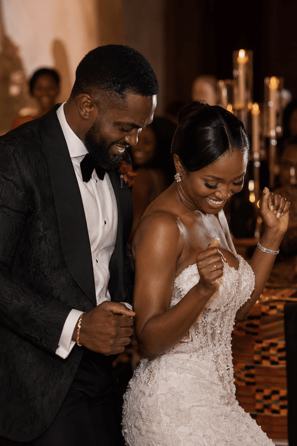 A Black newlywed couple dancing at their wedding reception