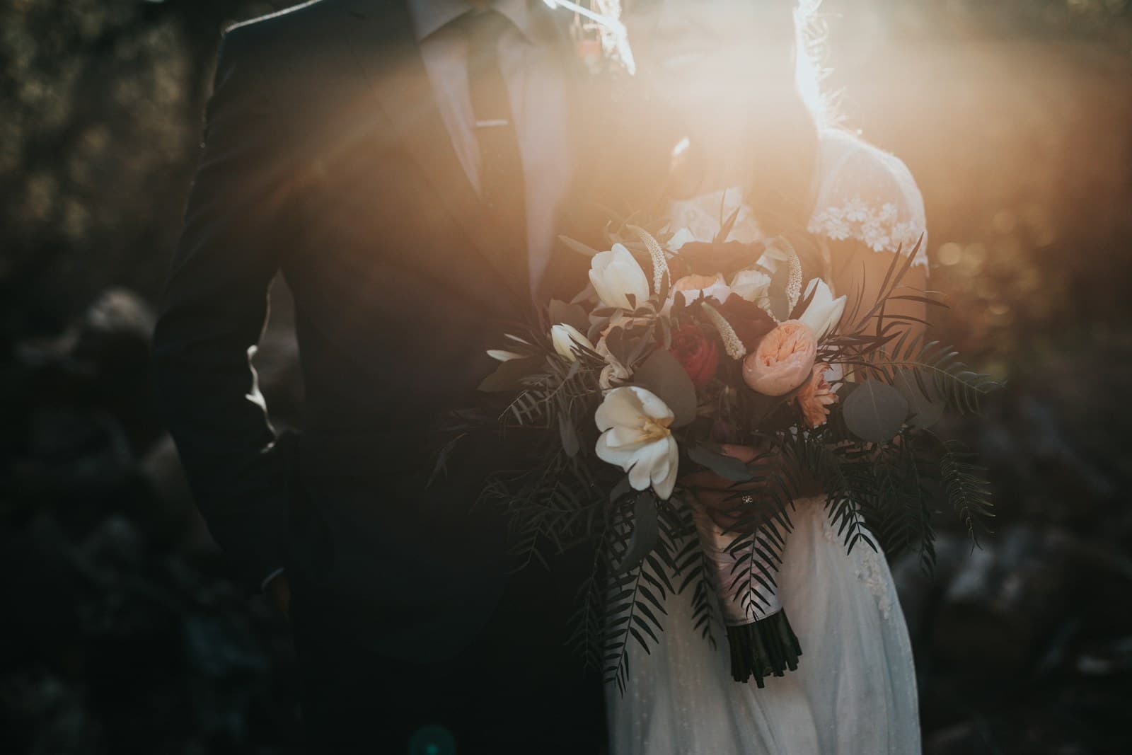 An intimate wedding celebration surrounded by flowers and greenery